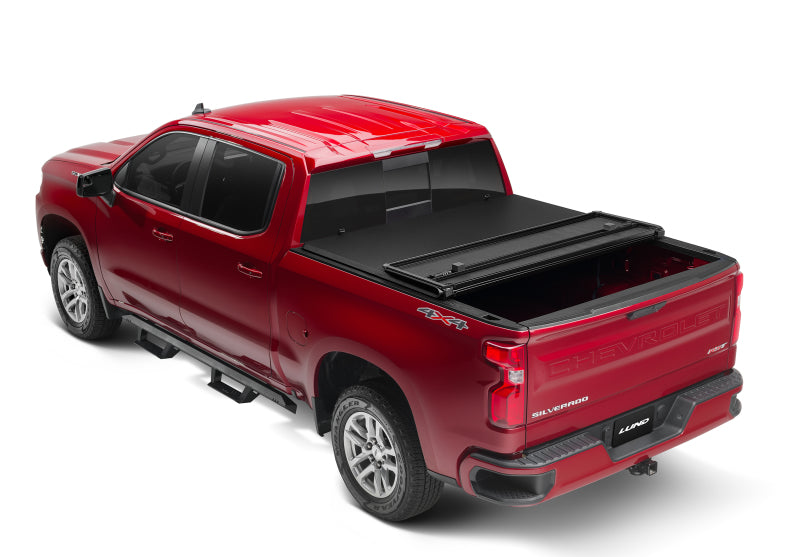 Lund 04-15 Nissan Titan (5.5ft. Bed) Hard Fold Tonneau Cover w/Bracket Kit - Black 969450