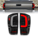 ANZO 16-21 Toyota Tacoma LED Tail Lights - w/ Light Bar Sequential Black Housing & Clear Lens 311400
