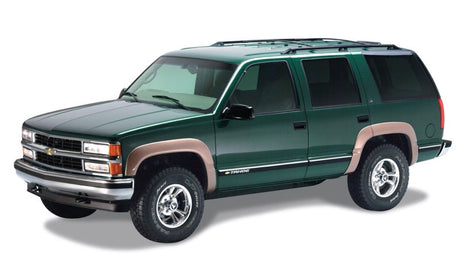 Bushwacker 97-99 Chevy Tahoe OE Style Flares 4pc 4-Door Only - Black 40905-02