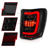 ANZO 1999-2004 Jeep Grand Cherokee LED Tail Lights w/ Light Bar Black Housing Smoke Lens 311395
