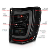 ANZO 1999-2004 Jeep Grand Cherokee LED Tail Lights w/ Light Bar Black Housing Smoke Lens 311395