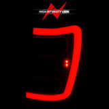 ANZO 1999-2004 Jeep Grand Cherokee LED Tail Lights w/ Light Bar Black Housing Smoke Lens 311395