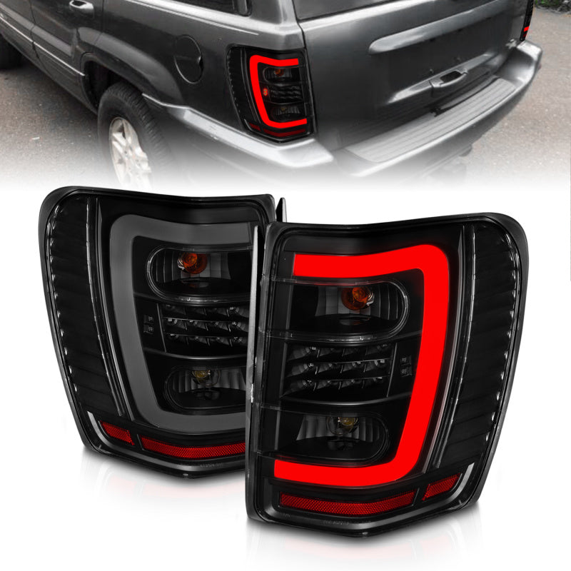 ANZO 1999-2004 Jeep Grand Cherokee LED Tail Lights w/ Light Bar Black Housing Smoke Lens 311395