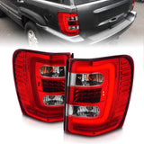 ANZO 1999-2004 Jeep Grand Cherokee LED Tail Lights w/ Light Bar Chrome Housing Red/Clear Lens 311396