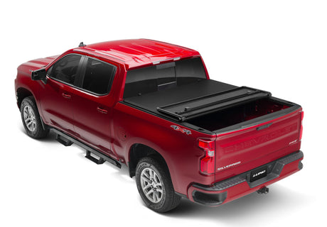 Lund 88-99 Chevy C1500 Fleetside (6.6ft. Bed) Hard Fold Tonneau Cover - Black 969150